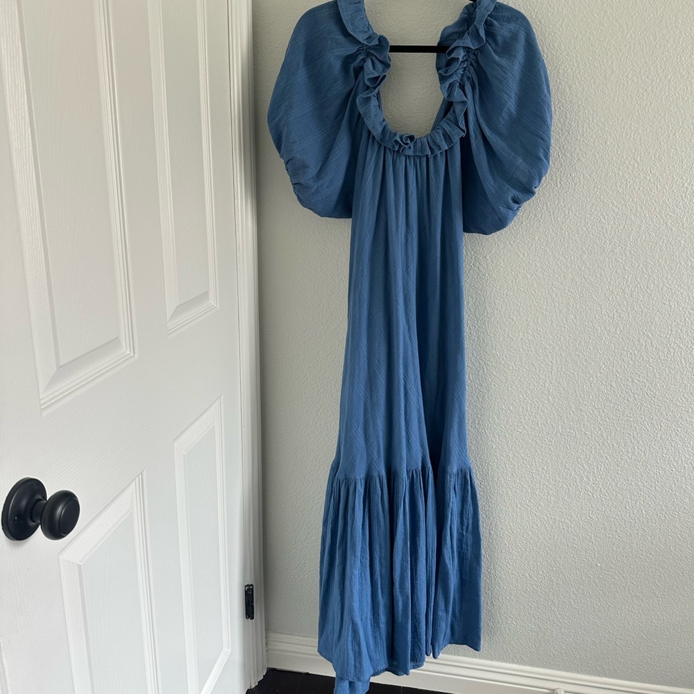 Elegant Blue Maxi Dress with Ruffled Sleeves. Open back with straps